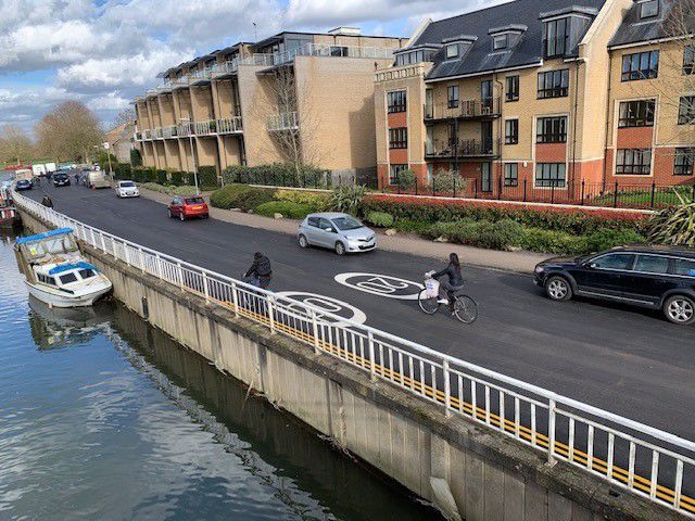 Newly resurfaced road surface alongside the River Cam